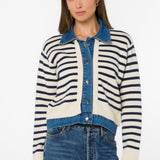 Woman wearing striped cardigan jacket with denim collar in ivory and blue