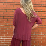 Made in Italy VNeck Silk Tunic with Ruffle Hem in Burgundy at ooh la la! in Grapevine TX 76051