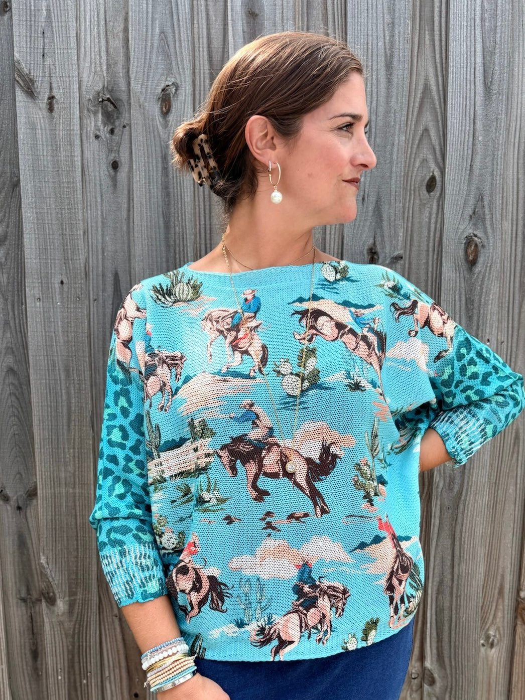 Giddy Up! Western Cowboys and Leopard Batwing Sweater in turquoise at ooh la la! in Grapevine TX 76051