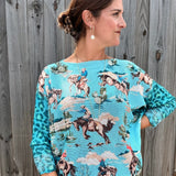 Giddy Up! Western Cowboys and Leopard Batwing Sweater in turquoise at ooh la la! in Grapevine TX 76051