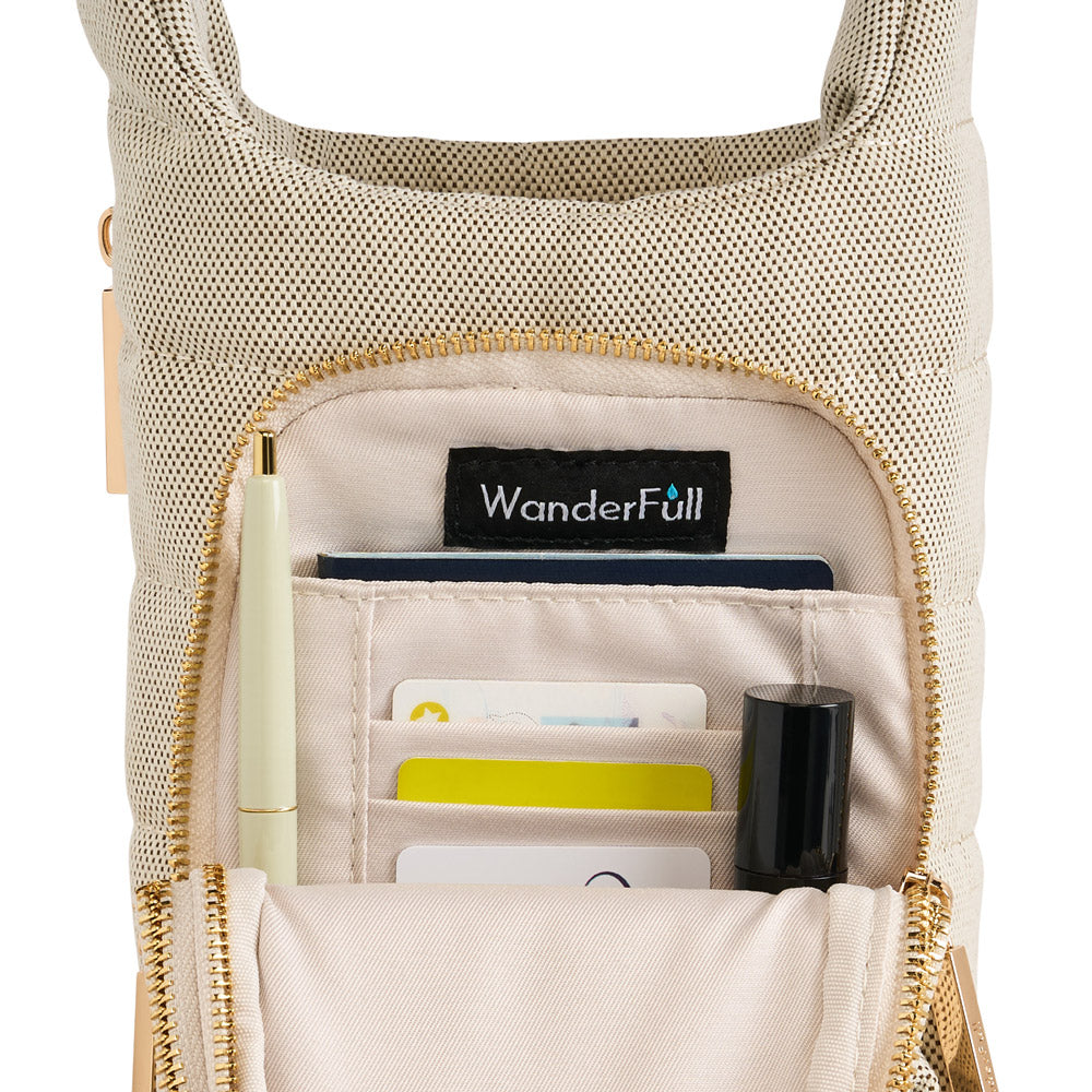 WanderFull HydroBag interior showing organized pockets with cards, pen, and lipstick