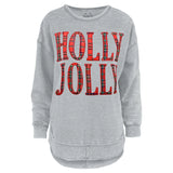 Light heather gray long-sleeve sweatshirt with a rounded, raw-edge hem. The front graphic features the text "HOLLY JOLLY" in large, bold block letters filled with a classic red and green tartan plaid pattern.