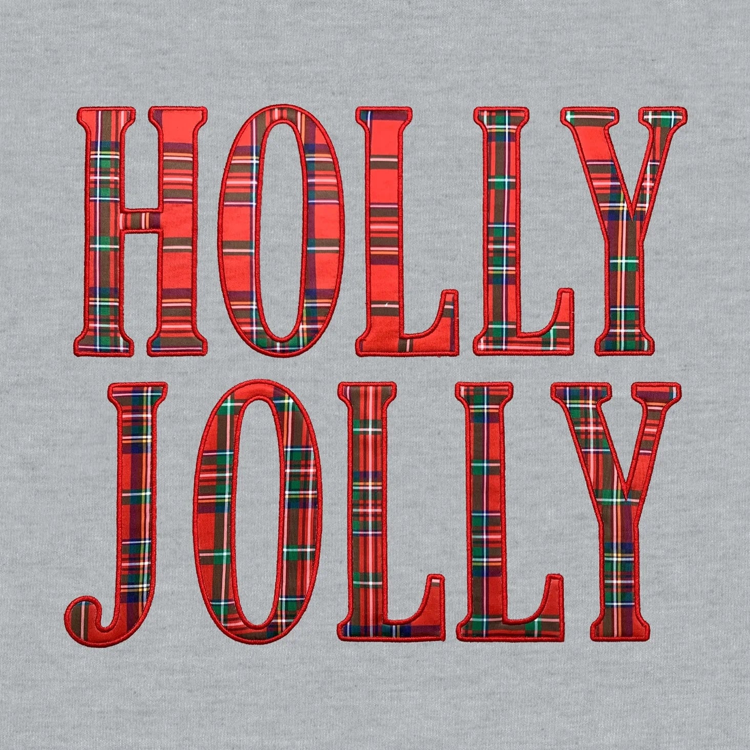 Front graphic features the text "HOLLY JOLLY" in large, bold block letters filled with a classic red and green tartan plaid pattern.