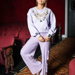 Wicked X Queen of Sparkles Lavender Wicked Charm Necklace Sweatshirt at ooh la la! in Grapevine TX 76051