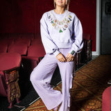 Wicked X Queen of Sparkles Lavender Wicked Charm Necklace Sweatshirt at ooh la la! in Grapevine TX 76051