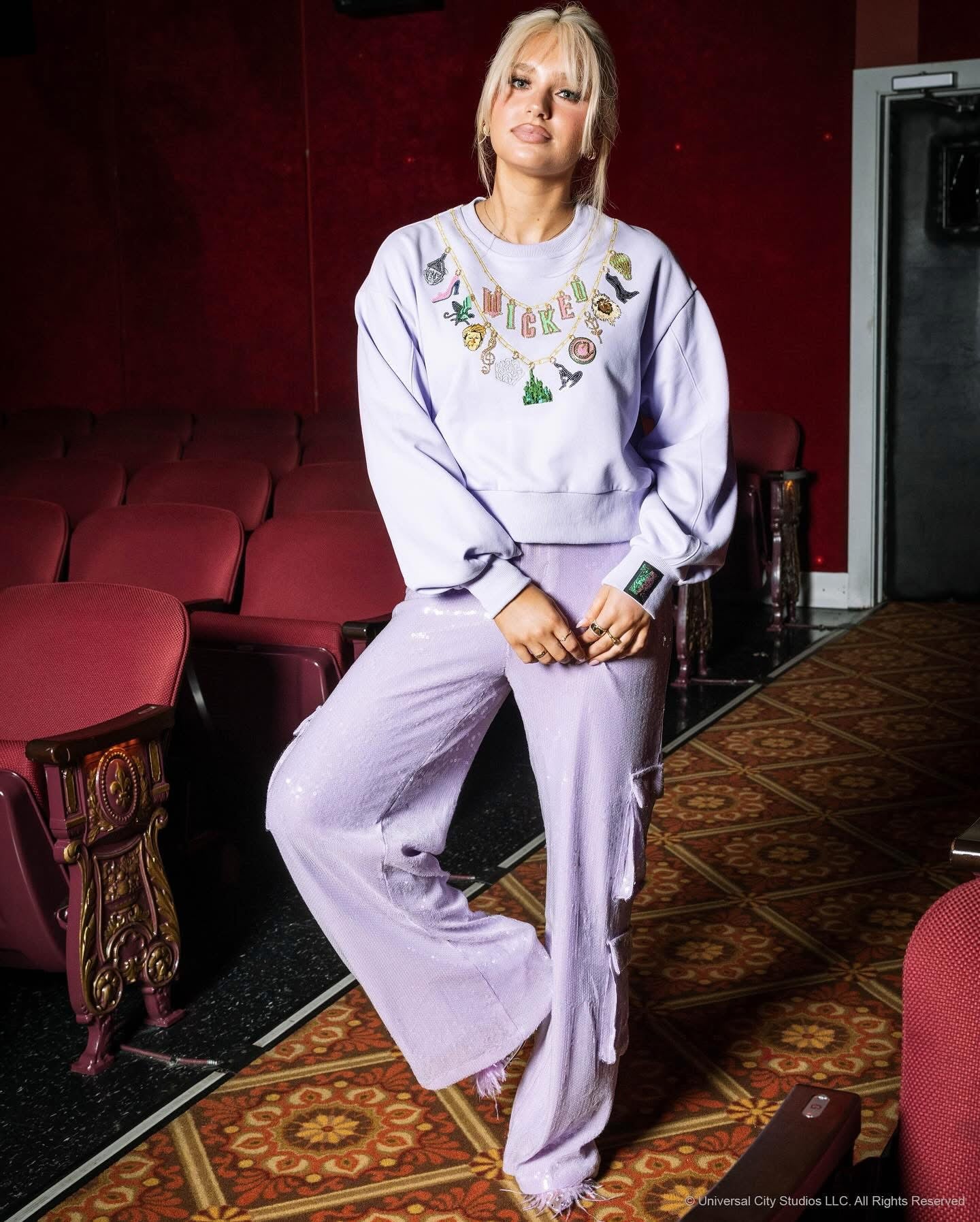 Wicked X Queen of Sparkles Lavender Wicked Charm Necklace Sweatshirt at ooh la la! in Grapevine TX 76051