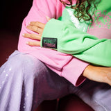 Wicked X Queen of Sparkles Green & Pink Colorblock Character Profile 'Wicked' Sweatshirt at ooh la la! in Grapevine TX 76051