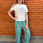 Western pajamas, rodeo print loungewear, soft pajama pants, cowgirl sleepwear, sage green pajamas, unisex pajama bottoms, boho western wear, rodeo lounge pants
at ooh la la! in Grapevine TX 76051