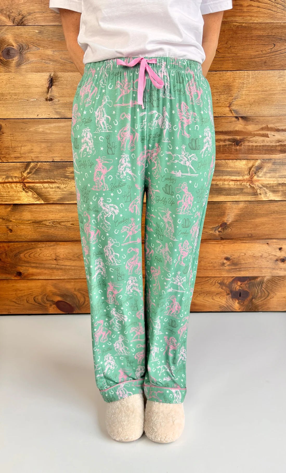 Western pajamas, rodeo print loungewear, soft pajama pants, cowgirl sleepwear, sage green pajamas, unisex pajama bottoms, boho western wear, rodeo lounge pants
at ooh la la! in Grapevine TX 76051