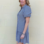 black gingham dress, cotton shirt dress, puff sleeve dress, lightweight summer dress, black and white gingham, women's cotton dress, tiered shirt dress, pebbles dress at ooh la la! in Grapevine TX 76051