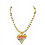 Tova Necklace with a colorful heart-shaped pendant on a white background