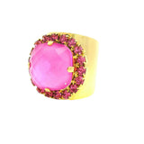 TOVA Cambrie Ring in Pink featuring large faceted hot pink stone with fuchsia crystal halo on wide gold band at ooh la la! in Grapevine TX 76051