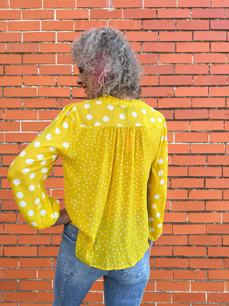 orange and white polka dot shirt