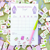 Taylor Paladino Mahjong Scorepad in Taylor Tiles colorway surrounded by decorative mahjong tiles