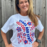 Patriotic Women's Apparel, Americana Tee, 4th of July Shirt, Floral Stars and Stripes, Premium Slub Cotton, Women's Graphic Tee, Red White and Blue Fashion, Summer Patriotic Tops. at ooh la la! in Grapevine TX 76051