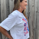 Patriotic Women's Apparel, Americana Tee, 4th of July Shirt, Floral Stars and Stripes, Premium Slub Cotton, Women's Graphic Tee, Red White and Blue Fashion, Summer Patriotic Tops. at ooh la la! in Grapevine TX 76051