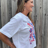 Patriotic Women's Apparel, Americana Tee, 4th of July Shirt, Floral Stars and Stripes, Premium Slub Cotton, Women's Graphic Tee, Red White and Blue Fashion, Summer Patriotic Tops. at ooh la la! in Grapevine TX 76051