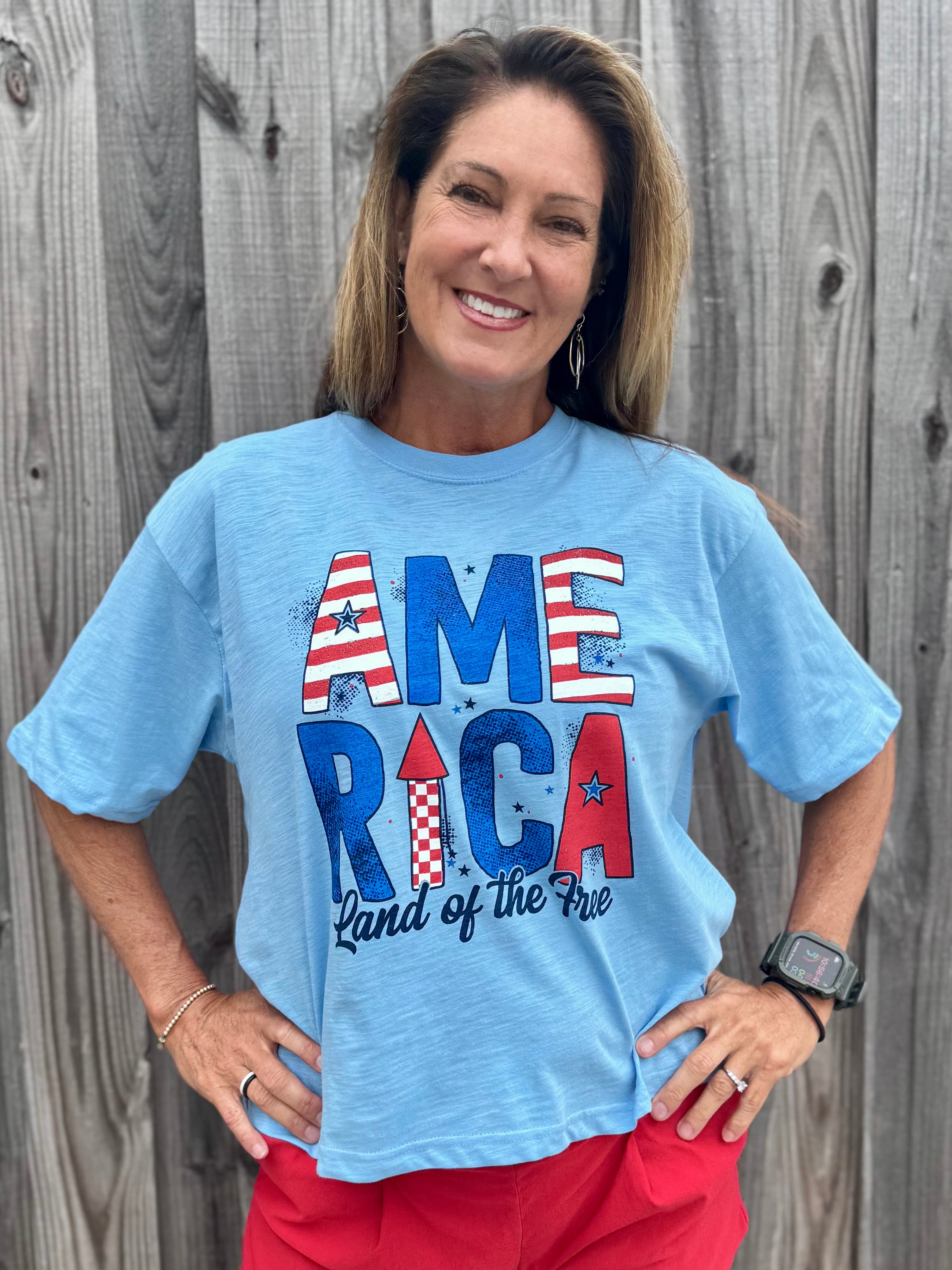 Patriotic graphic tee, slub cotton shirt, 4th of July outfit, American flag t-shirt, boxy fit cotton tee, Land of the Free shirt, women’s patriotic apparel, textured cotton t-shirt. at ooh la la! in Grapevine TX 76051
