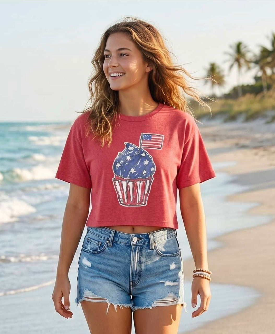 Americana crop top, vintage wash tee, cupcake graphic t-shirt, 4th of July outfit, women's cropped shirt, patriotic summer apparel, nostalgic fashion, red white and blue top. at ooh la la in Grapevine TX 76051