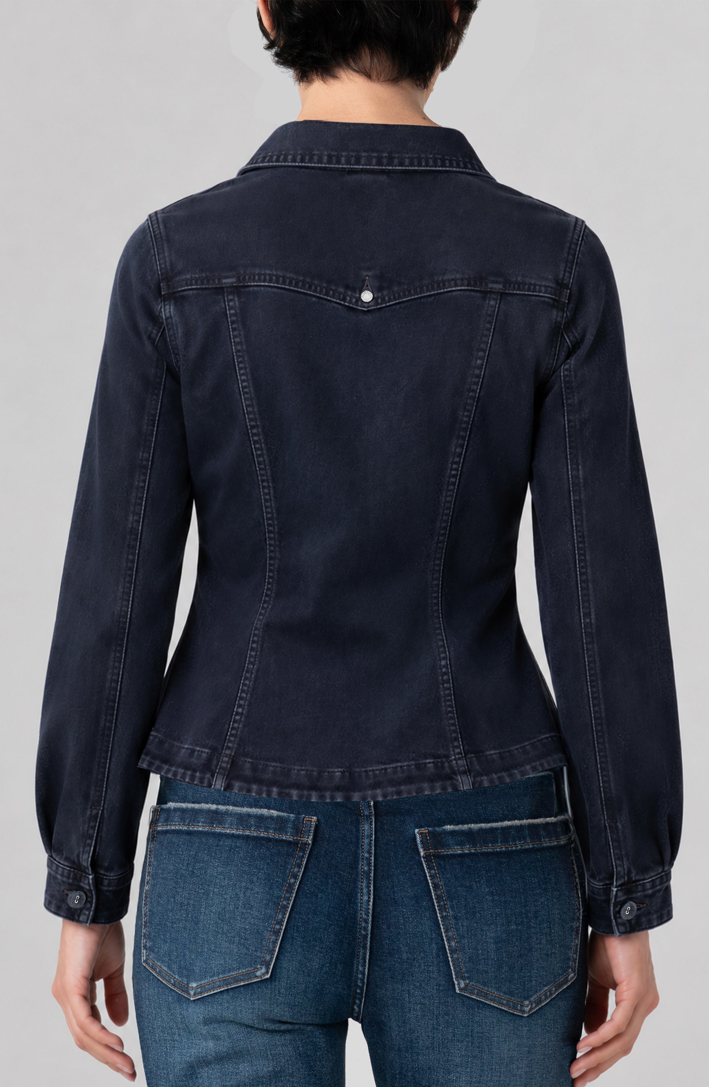 Back view of Liverpool fitted dark navy denim jacket with patch pockets on model