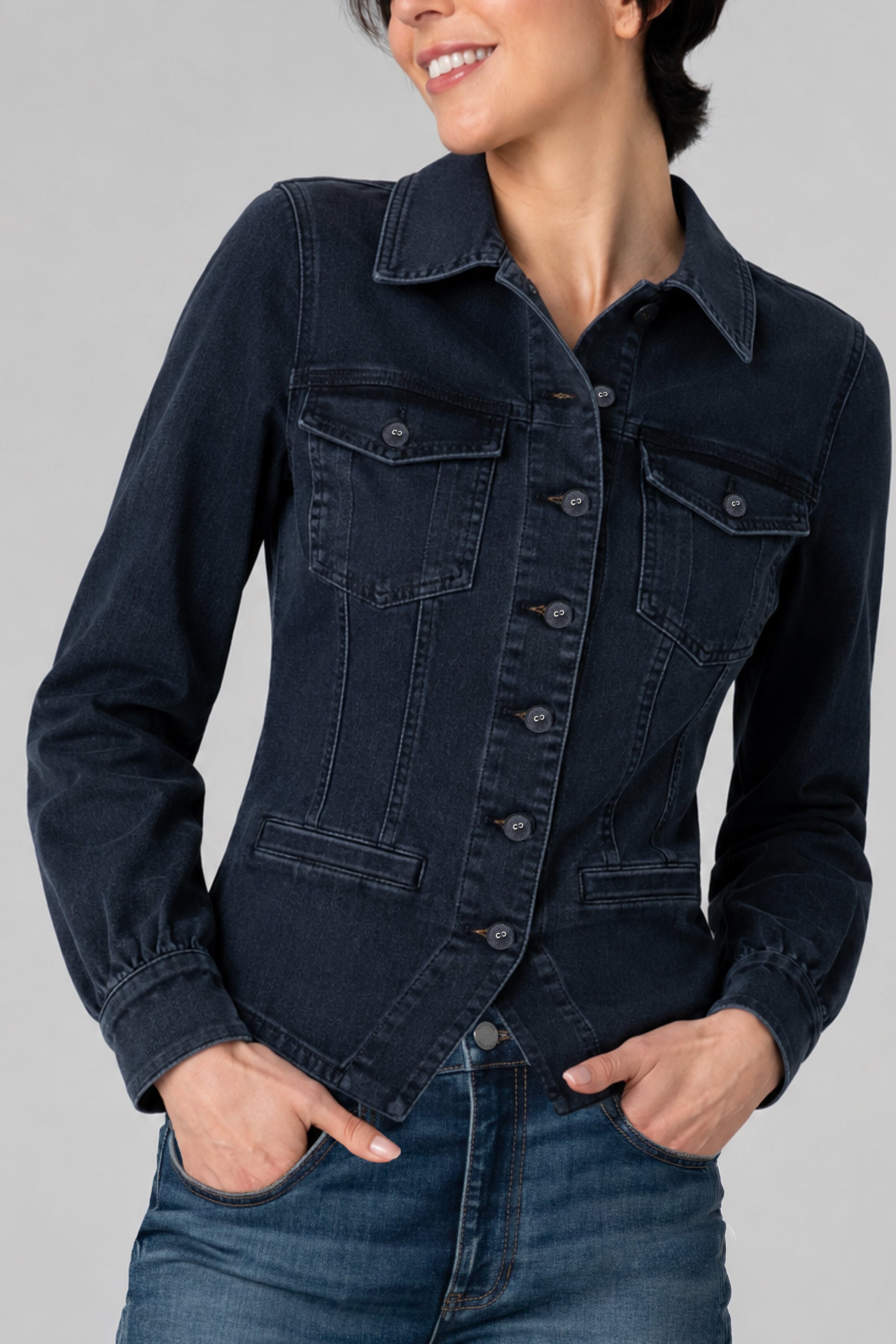 Woman wearing Liverpool fitted dark navy denim jacket with patch pockets and button front
