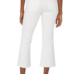 White crop flare jeans with twisted slit detail, back view on model