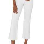 Woman wearing white crop flare jeans with black top and strappy heels