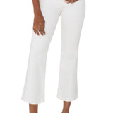 Woman wearing white crop flare jeans with black top and strappy heels