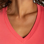 Liverpool Short Sleeve V-Neck Tee in Sunset Coral worn by female model, close-up neckline view