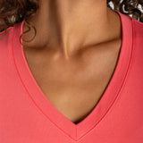 Liverpool Short Sleeve V-Neck Tee in Sunset Coral worn by female model, close-up neckline view