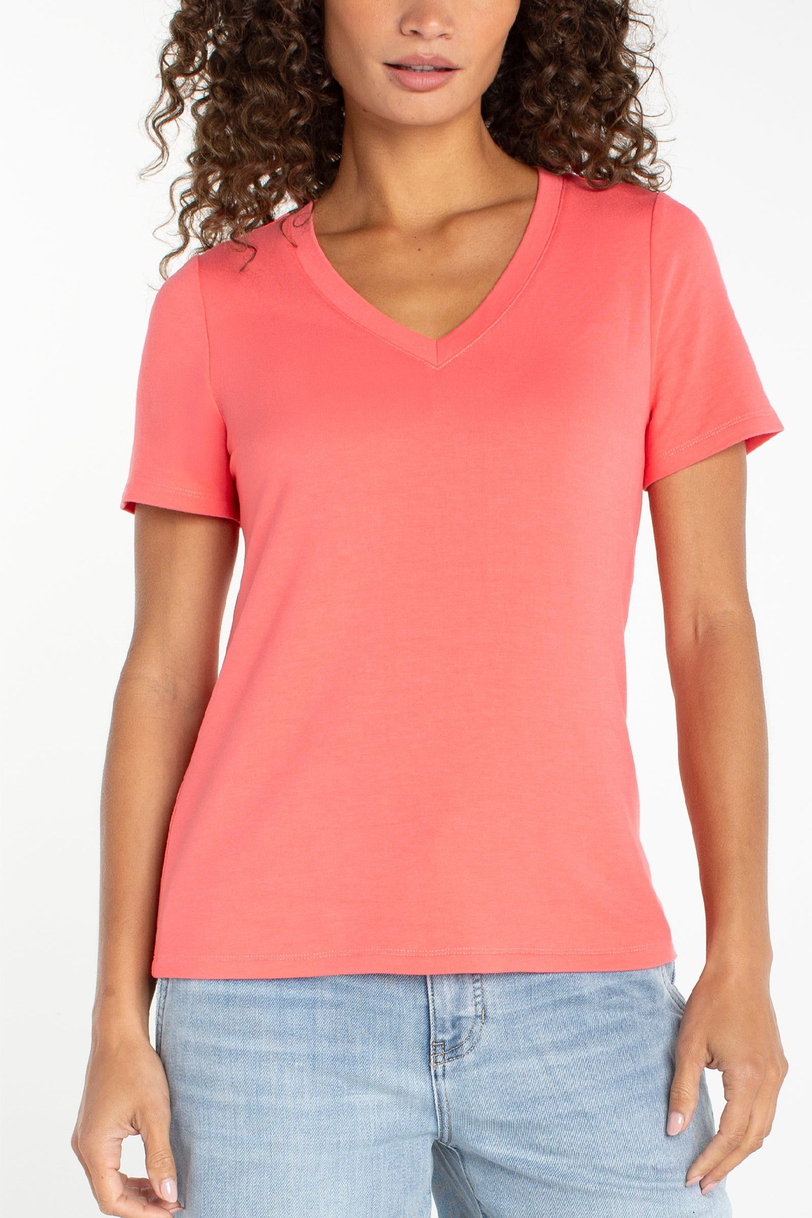 Liverpool short sleeve v-neck tee in sunset coral worn with light wash jeans