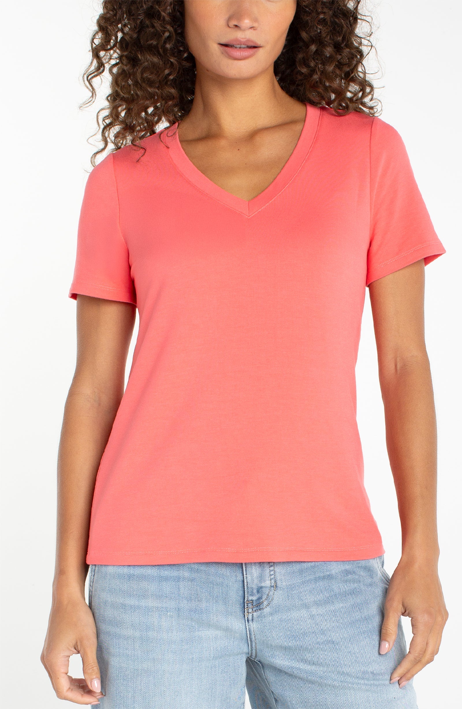Liverpool short sleeve v-neck tee in sunset coral worn with light wash jeans