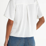 Liverpool short sleeve camp collar satin blouse in whipped cream, back view on model
