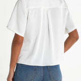 Liverpool short sleeve camp collar satin blouse in whipped cream, back view on model