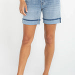 Woman wearing Liverpool Keeper Cuff Short in light blue denim with rolled cuffs