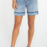 Woman wearing Liverpool Keeper Cuff Short in light blue denim with rolled cuffs