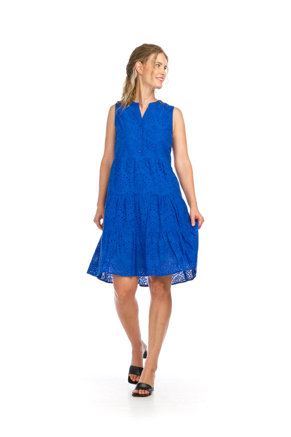Woman wearing royal blue eyelet henley dress with tiered skirt and button front