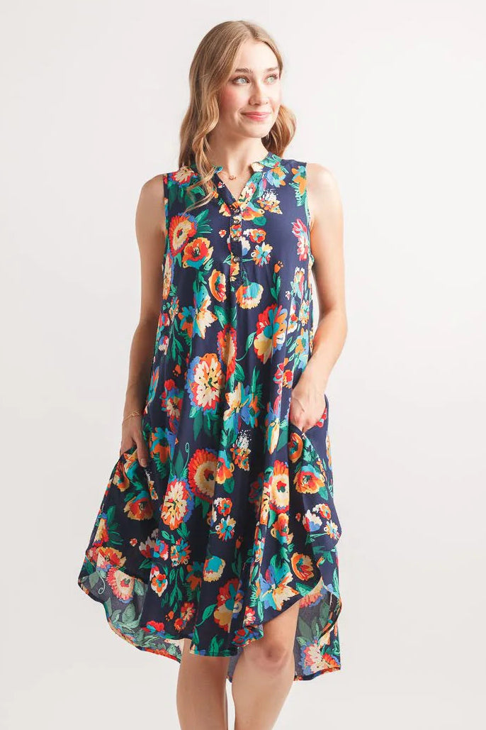 Navy floral swing dress, sleeveless Henley dress, lightweight viscose sundress, abstract print summer dress, casual floral dress with pockets, women's flowy summer fashion. at ooh la la! in Grapevine TX 76051