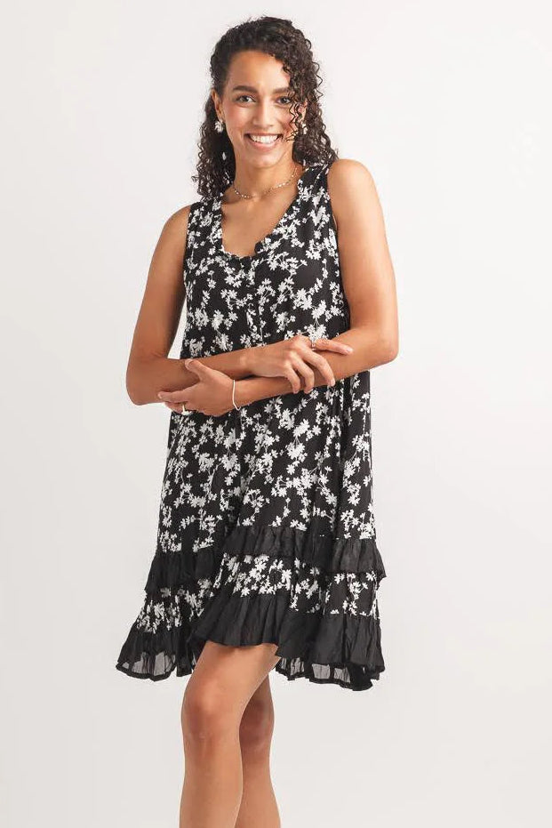 ditsy floral dress, black and white shift dress, ruffle hem mini dress, sleeveless summer dress, lightweight viscose dress, casual floral outfit, tiered ruffle dress. at ooh la la! in Grapevine TX 76051