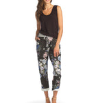 Woman wearing black bamboo v-neck tank top with floral pants
