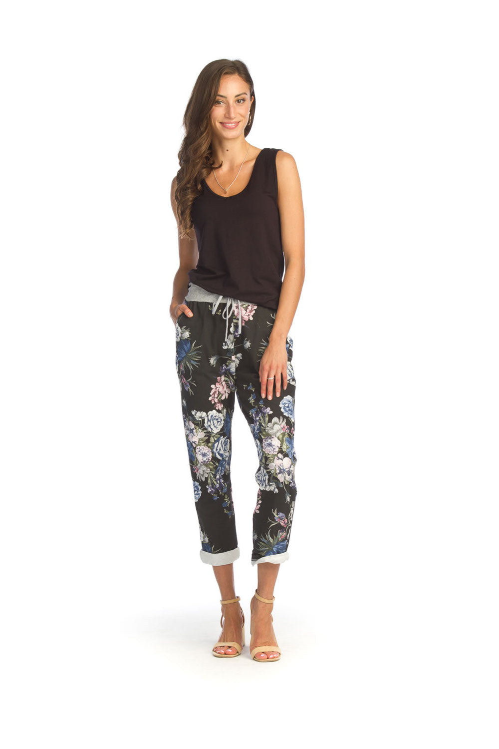 Woman wearing black bamboo v-neck tank top with floral pants
