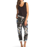 Woman wearing black bamboo v-neck tank top with floral pants