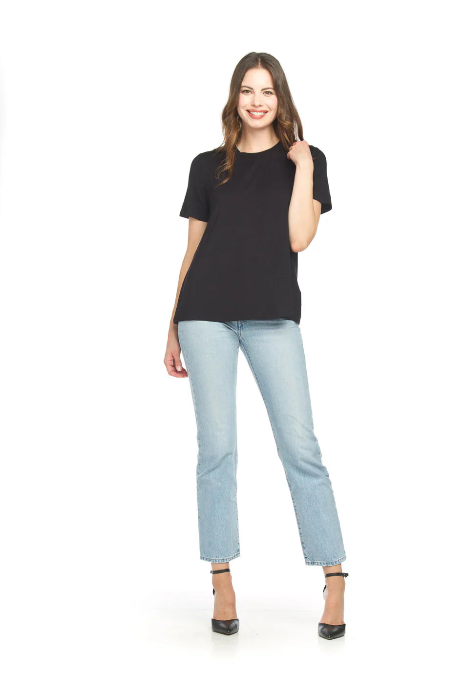 Woman wearing black bamboo tee with light blue jeans and black heels