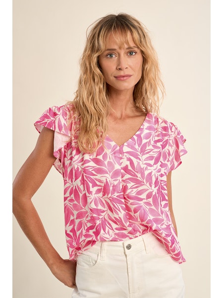Flutter sleeve top, floral V-neck blouse, lightweight summer top, ruffled sleeve shirt, women’s botanical print top, pink floral blouse, breezy spring fashion. at ooh la la! in Grapevine TX 76051
