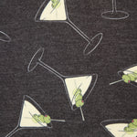 Pattern of martini glasses with frogs on a dark background