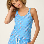 Woman wearing bay blue star print camisole and matching shorts pajama set