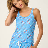 Woman wearing bay blue star print camisole and matching shorts pajama set