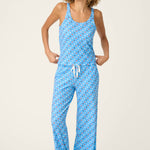 Woman wearing bay blue star print camisole and matching pajama pants