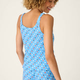 Woman wearing bay blue camisole with red white gray star print