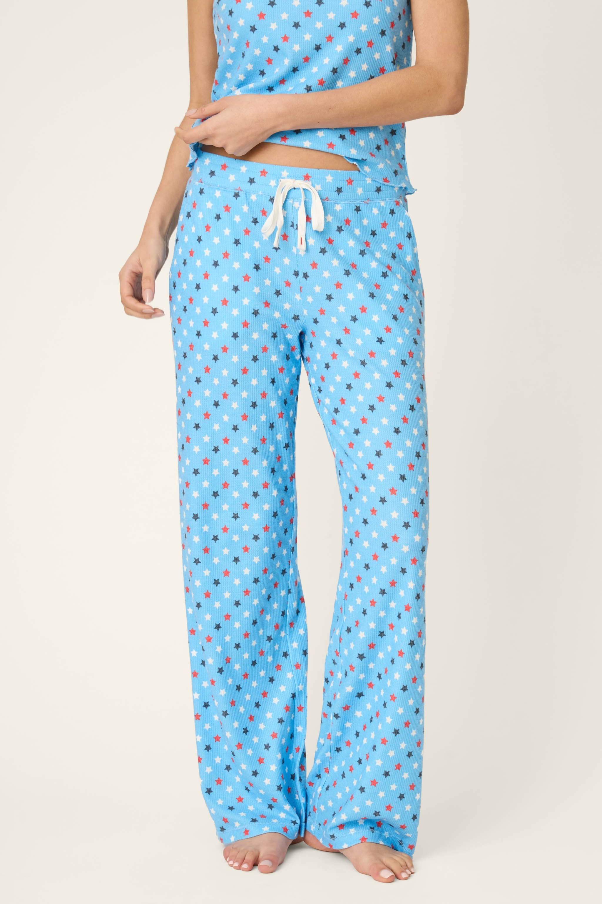 Bay blue pajama pants with patriotic red white navy star print and drawstring waist